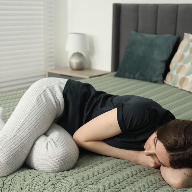 image_0002_sad-young-woman-lying-bed-home